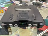 a video game console sitting on top of a glass table