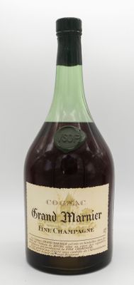 an image of a bottle of grand marnier next to a glass of wine