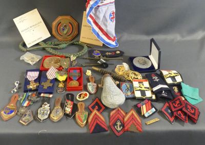 a lot of medals and other items on a table