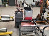 a machine that is sitting on a cart in a garage
