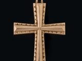 une image représentant une croix dorée sur fond noir