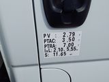 a close up of the door handle of a white truck