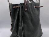 black leather tote bag with two handles and a zipper closure