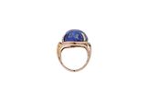 a close up of a ring with a lapis stone on it