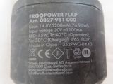 an image of a close up of a power adapter on a white surface