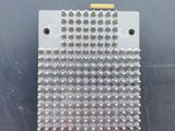 a close up of a metal plate with rivets on it