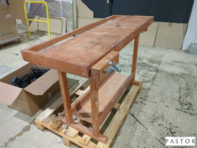 a picture of a workbench with a box of shoes on it