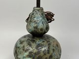 a lamp that is sitting on top of a stone
