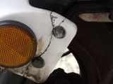 a close up of a motorcycle with a yellow light on it