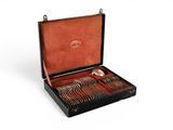 a black case with silverware in it on a white surface