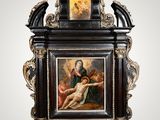an image of a clock with a painting of jesus on it