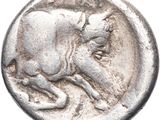 a close up of a silver coin with a bull on it