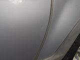 a close up of a car ' s front fender and wheel