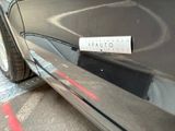 a sticker on the side of a black car