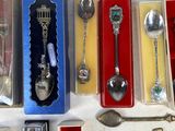 many spoons and spoon spoons sitting in a box