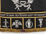 black banner with gold fringes and a picture of a man holding a sword and shield