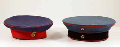 two hats sitting next to each other on a table