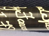 a close up of a pen with writing on it