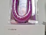 an image of a purple inflatable device sitting on top of a white box