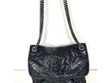 Sac à bandoulière Chanel en cuir d'agneau matelassé noir