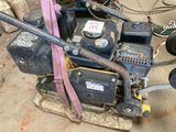 a machine that is sitting on a pallet in a garage