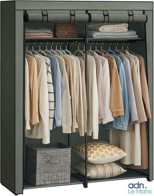 an image of a closet with clothes on hangers