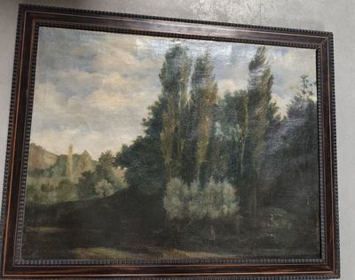 a painting hanging on the wall of a room