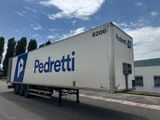a semi truck that is parked in front of a building