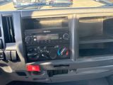 a dashboard of a truck with a radio in it