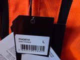 a luggage tag attached to an orange piece of luggage