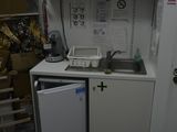a small kitchen with a sink and a dishwasher in it