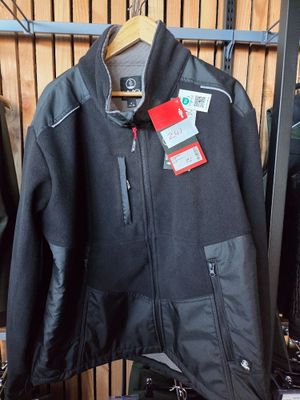 jacket hanging on a rack in a clothing store with a price tag on it