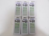 four boxes of calculator sitting on top of a white table
