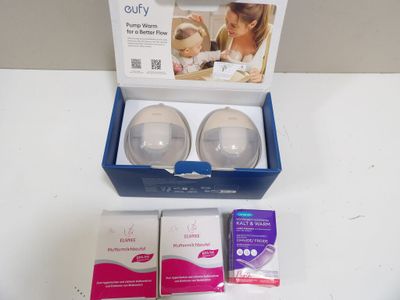a box with two baby bottles in it on a table