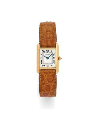 une montre Cartier Tank en or jaune 18 carats avec un bracelet en cuir d'alligator