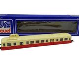the train is red and white with a red stripe