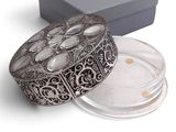 an image of a box with a silver lid and a silver lid on it