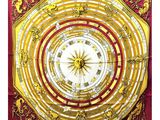 un gros plan sur une écharpe rouge et jaune ornée d'une horloge