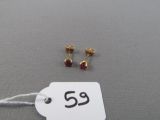 a tag with a pair of earrings on it