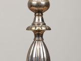 a glass bowl on top of a metal stand