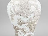 chinese white glazed vase with dragon and waves design