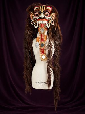 a close up of a mannequin with a mask on it ' s head