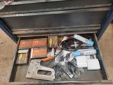 a metal tool box with tools in it on the floor