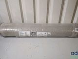 a roll of fabric sitting on top of a radiator