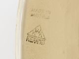 a close up of a vase with a drawing on it