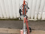 a scooter that is sitting on the side of the street