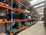 a large warehouse filled with lots of shelves and pallets