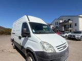 the white van is parked in the parking lot in front of a building