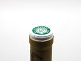 a close up of a bottle of coffee on a table