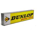 dunlop plus moto sign with a yellow and white background